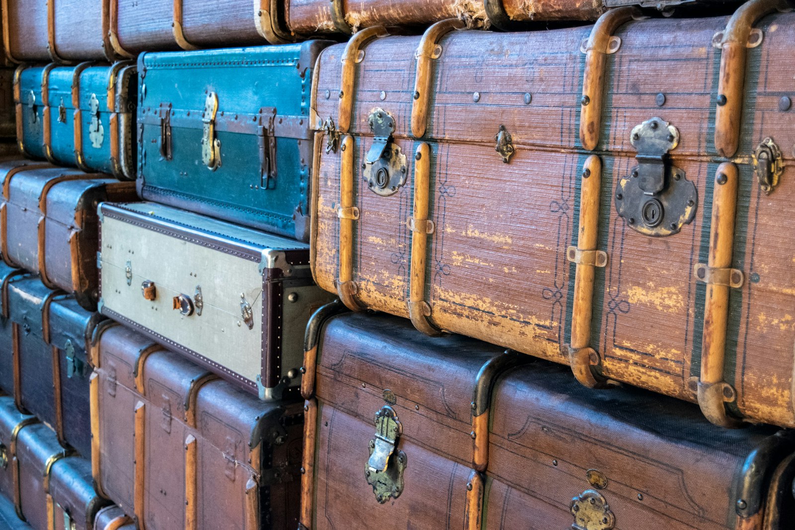 A neat row of stacked carry-on suitcases