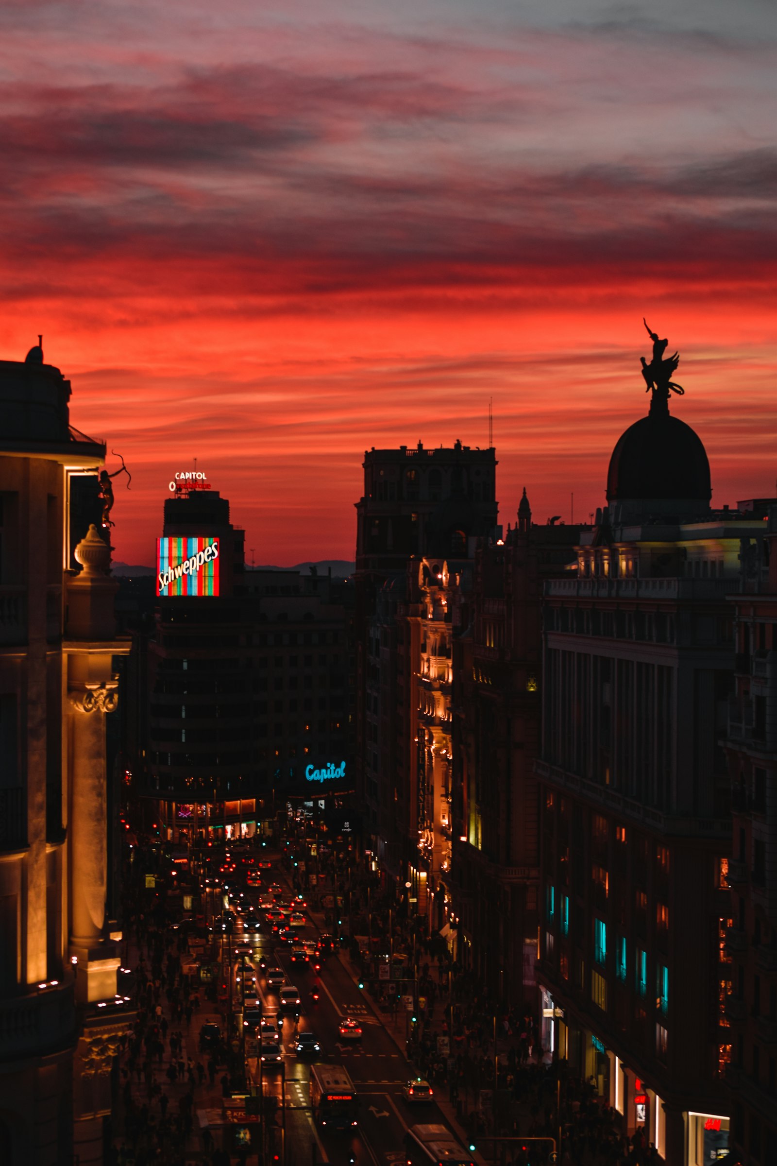 A narrow street in central Madrid in late afternoon light