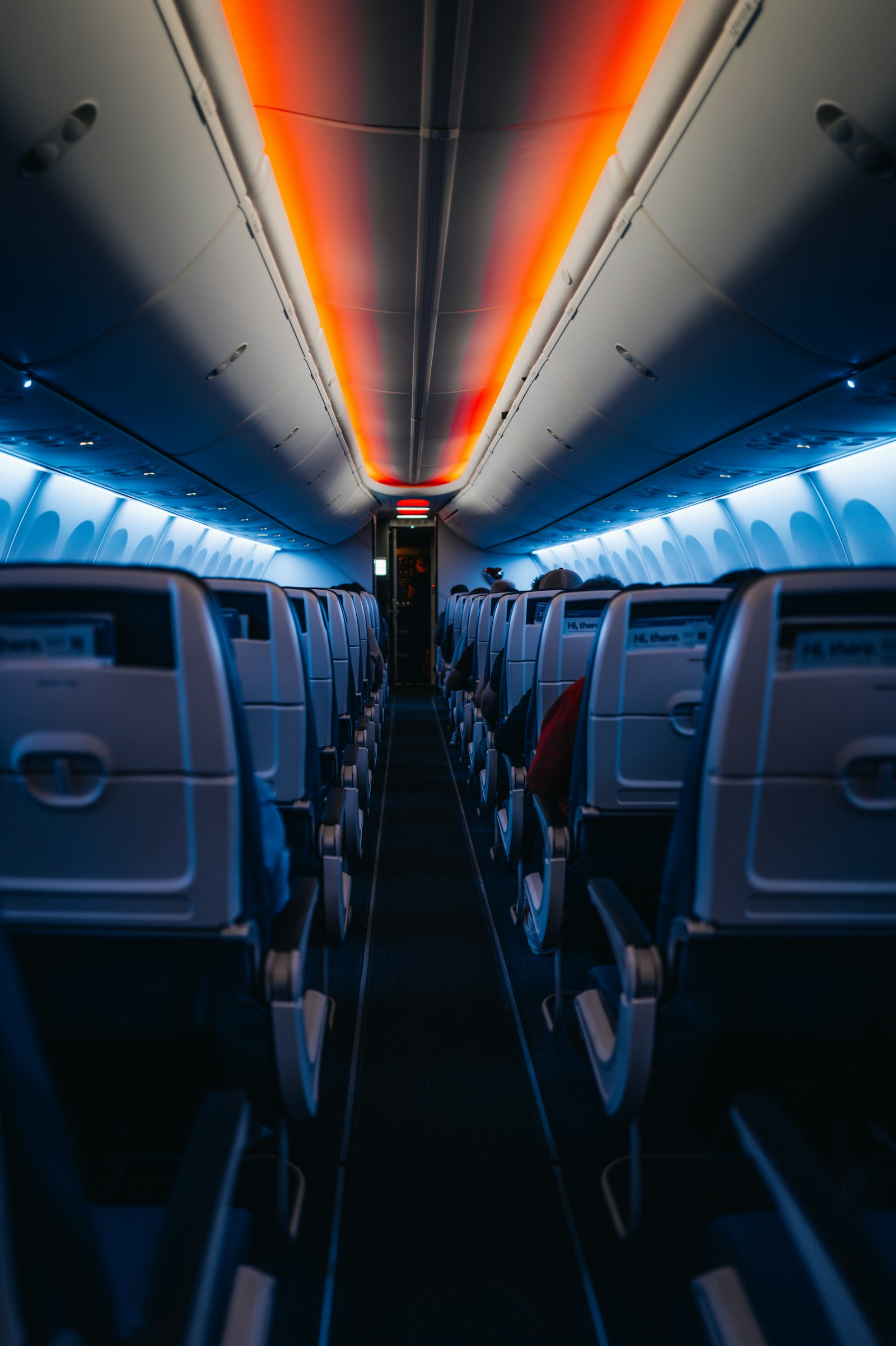 Dim airplane cabin interior at night